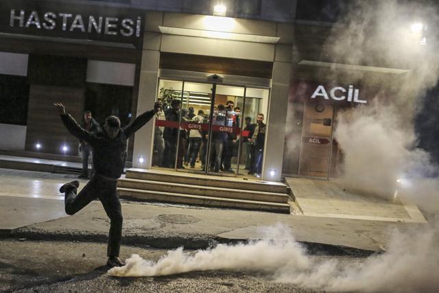 A man kicks back a tear gas canister fired by Turkish police to disperse protesters during minor clashes in Istanbul. (AP) A man kicks back a tear gas canister fired by Turkish police to disperse protesters during minor clashes in Istanbul. (AP)