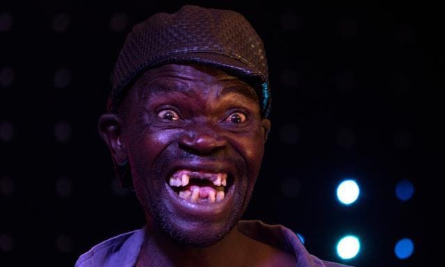 Newly crowned "Mr Ugly" Zimbabwe, Mison Sere, poses during the "Ugliest Man" contest in Harare, Zimbabwe, on November 20, 2015. AFP PHOTO/JEKESAI NJIKIZANA (AFP) Newly crowned "Mr Ugly" Zimbabwe, Mison Sere, poses during the "Ugliest Man" contest in Harare, Zimbabwe, on November 20, 2015. AFP PHOTO/JEKESAI NJIKIZANA (AFP)