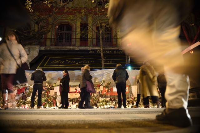 People gather at a makeshift memorial in tribute to the victims of a series of deadly attacks in Paris. Gunmen and suicide bombers went on a killing spree in Paris on November 13, attacking a concert hall as well as bars, restaurants and the Stade de France. Islamic State militants operating out of Iraq and Syria released a statement claiming responsibility for the coordinated attacks. (AFP) People gather at a makeshift memorial in tribute to the victims of a series of deadly attacks in Paris. Gunmen and suicide bombers went on a killing spree in Paris on November 13, attacking a concert hall as well as bars, restaurants and the Stade de France. Islamic State militants operating out of Iraq and Syria released a statement claiming responsibility for the coordinated attacks. (AFP)