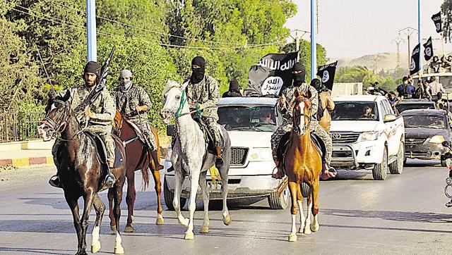 Militant Islamist fighters ride horses during a military parade along the streets of Raqqa province in 2014, to celebrate their declaration of an Islamic "caliphate". (Reuters file photo)
