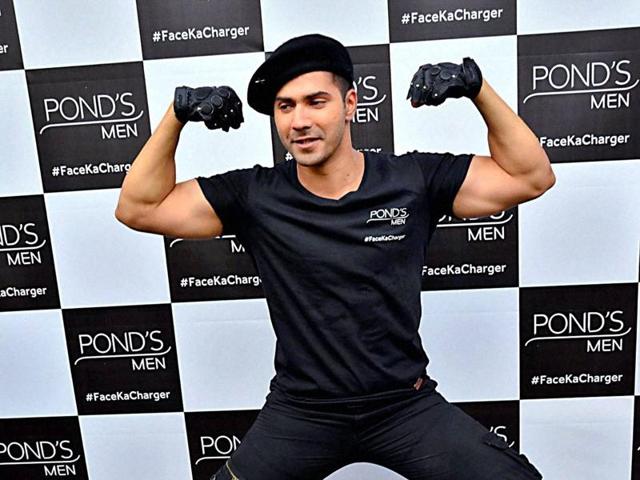 Varun Dhawan shows flaunts his body at an event in Mumbai on Monday. (PTI)