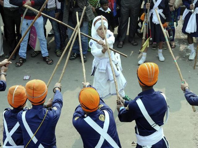 Sikhs display their Gatka skills, a form of Sikh martial art, during a religious Gurupurab procession, on the eve of the birth anniversary of Guru Nanak Dev at Gurudwara Sis Ganj Sahib, Chandhi Chowk, in New Delhi. (Sonu Mehta/HT Photo) Sikhs display their Gatka skills, a form of Sikh martial art, during a religious Gurupurab procession, on the eve of the birth anniversary of Guru Nanak Dev at Gurudwara Sis Ganj Sahib, Chandhi Chowk, in New Delhi. (Sonu Mehta/HT Photo)
