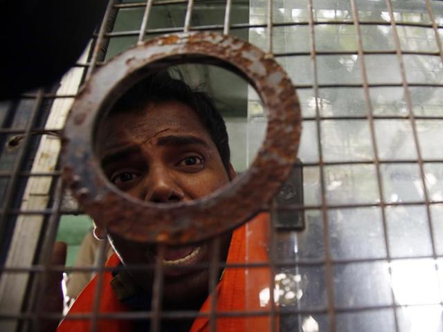 A Hindu Sena activist shouts slogans after he was arrested by police outside Bollywood actor Aamir Khan's residence in Mumbai on Tuesday, Nov. 24, 2015. (AP)