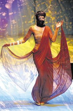 An Indian model displays an outfit by designer Hemant Trivedi at the Grand Finale of the Lakme India Fashion Week 2003 at the National Centre for Performing Arts complex in Bombay, 24 July 2003. The Lakme India Fashion Week, organised by the Fashion Design Council of India (FDCI), showcased the work of 57 leading Indian designers with 35 shows and exhibitions. (AFP)