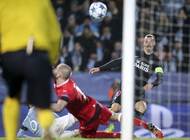 Zlatan Ibrahimovic scores past Malmo's goalkeeper Johan Wiland. (AFP Photo)