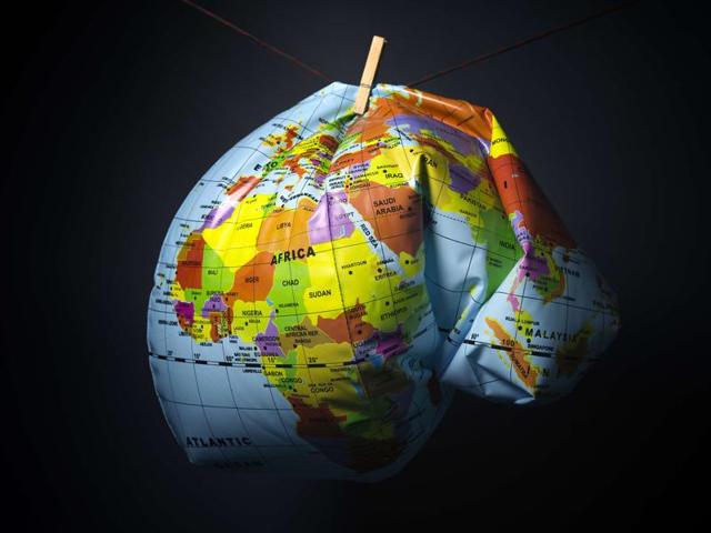 An illustration made in Paris on November 8, 2015 shows a deflated earth globe. Earth has heated up by one degree Celsius, Britain's weather office said on November 9, as greenhouse gases hit record levels just weeks before climate summit in Paris.(AFP) An illustration made in Paris on November 8, 2015 shows a deflated earth globe. Earth has heated up by one degree Celsius, Britain's weather office said on November 9, as greenhouse gases hit record levels just weeks before climate summit in Paris.(AFP)