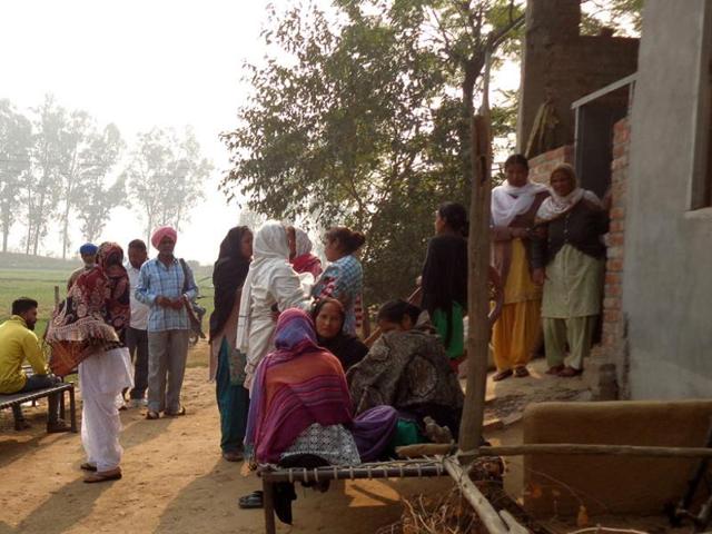 Relatives of Bachan Singh mourning outside their house in Dhaliwal Dona village after hearing about the accident. (HT Photo) Relatives of Bachan Singh mourning outside their house in Dhaliwal Dona village after hearing about the accident. (HT Photo)