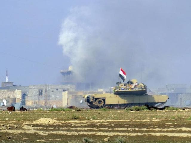 A national flag waves on an Iraqi Army tank as Iraqi forces supported by U.S.-led coalition airstrikes advance their position during clashes with Islamic State group in the western suburbs of Ramadi, the capital of Anbar province, Saturday, Nov. 21, 2015. (AP) A national flag waves on an Iraqi Army tank as Iraqi forces supported by U.S.-led coalition airstrikes advance their position during clashes with Islamic State group in the western suburbs of Ramadi, the capital of Anbar province, Saturday, Nov. 21, 2015. (AP)
