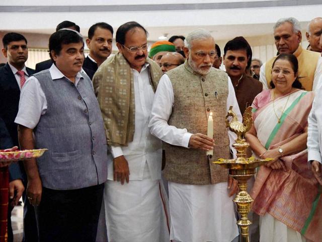 Prime Minister Narendra Modi at the inauguration of an exhibition on making of the Constitution by the Constituent Assembly, at Parliament Library, in New Delhi on Thursday. Lok Sabha speaker Sumitra Mahajan, deputy speaker M Thambidurai, union minister of parliamentary affairs M Venkaiah Naidu, transport minister Nitin Gadkari and others leaders also seen . (PTI)