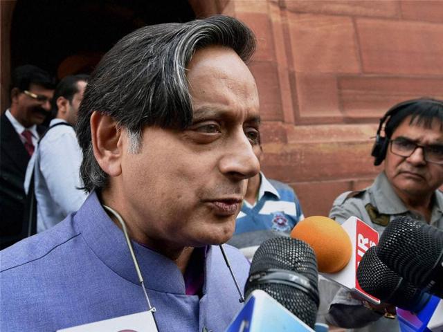 Congress MP Shashi Tharoor talking to media at the first day of winter session. (PTI)