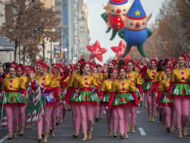 Dancers move down Central Park West during the Macy’s Thanksgiving Day Parade, Thursday in New York. A record number of police officers were patrolling the parade as security is on a high alert after the terror attacks in Paris and threats made to New York. (AP) Dancers move down Central Park West during the Macy’s Thanksgiving Day Parade, Thursday in New York. A record number of police officers were patrolling the parade as security is on a high alert after the terror attacks in Paris and threats made to New York. (AP)