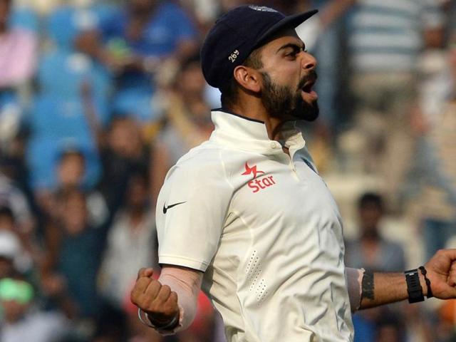 India's captain Virat Kohli celebrates after winning the third Test match between India and South Africa in Nagpur on November 27, 2015. India won by 124 runs to clinch the series 2-0. (AFP Photo)
