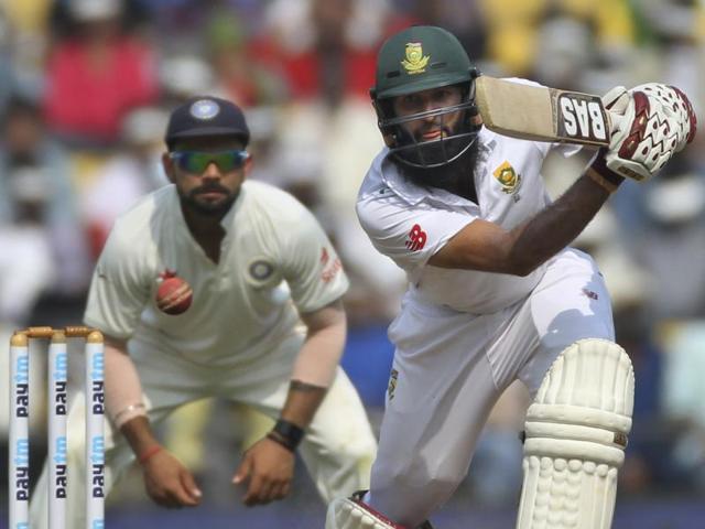 As Virat Kohli watches, South Africa’s captain Hashim Amla hits a drive. (AP Photo)