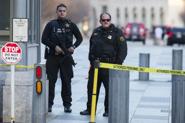 Secret Service police stand guard outside the White House after a man was caught jumping the fence as President Barack Obama and his family ate Thanksgiving dinner. (AP Photo) Secret Service police stand guard outside the White House after a man was caught jumping the fence as President Barack Obama and his family ate Thanksgiving dinner. (AP Photo)