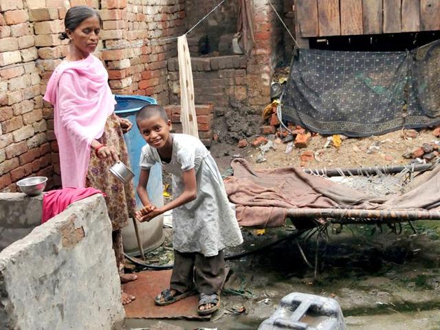 Many Indians live in damp hovels in fetid slums with sewage running in open drains in front of their homes while their children play in the filth. How do they survive all this? (AFP File Photo) Many Indians live in damp hovels in fetid slums with sewage running in open drains in front of their homes while their children play in the filth. How do they survive all this? (AFP File Photo)