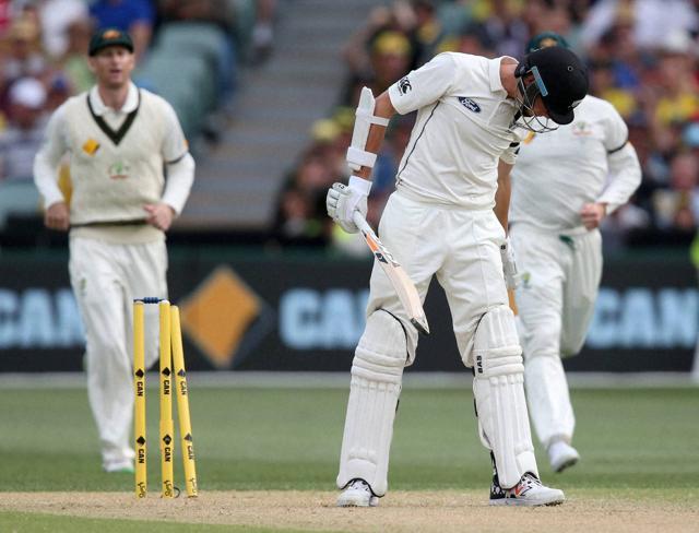 New Zealand's Mitchell Santner looks down after he was out bowled for 31 runs. (AP)