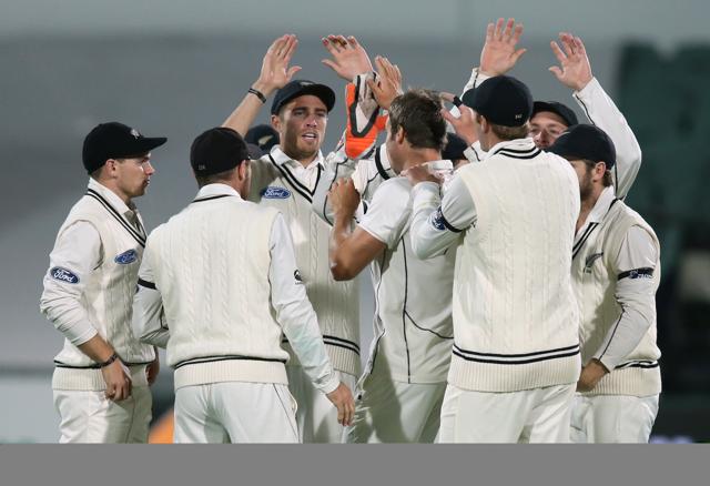 New Zealand players celebrate after dismissing Australia's Joe Burns during their cricket test in Adelaide, Friday, Nov. 27, 2015. This match is the sport's first ever day-night test and the use of the “experimental” pink leather ball replacing the standard-issue red for the first time in a format that dates back to the 1870s. (AP Photo/Rick Rycroft) (AP)