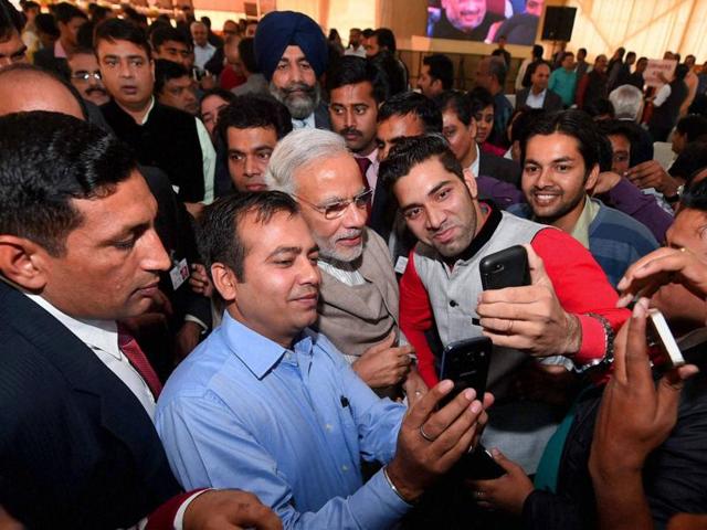 Prime Minister Narendra Modi poses for a selfie with reporters during the Diwali Mangal Milan at BJP headquarters in New Delhi on Saturday. (PTI) Prime Minister Narendra Modi poses for a selfie with reporters during the Diwali Mangal Milan at BJP headquarters in New Delhi on Saturday. (PTI)