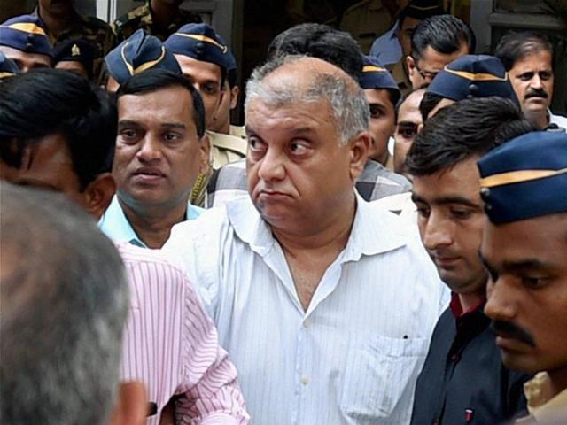 Peter Mukerjea is escorted after being produced by the CBI at the Esplanade court.(PTI) Peter Mukerjea is escorted after being produced by the CBI at the Esplanade court.(PTI)