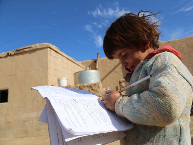 Four-year-old Syrian girl, Baydaa, scribbles on a leaflet of religious rules left behind by the Islamic State (IS) group as they fled, in the Al-Shallal suburb of the northeastern town of Al-Hol in Syria's Hasakeh province, bordering with Iraq. (AFP photo) Four-year-old Syrian girl, Baydaa, scribbles on a leaflet of religious rules left behind by the Islamic State (IS) group as they fled, in the Al-Shallal suburb of the northeastern town of Al-Hol in Syria's Hasakeh province, bordering with Iraq. (AFP photo)