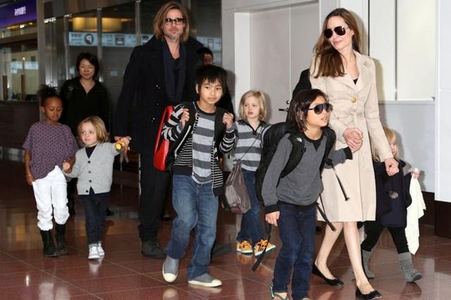 It’s a sight to see whenever the star couple steps out with all six kids. (AP)