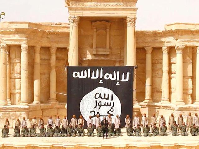 An image grab taken from a video made available by a Jihadist media outlet allegedly shows 25 Syrian government soldiers kneeling in front of, what appears to be children or teenagers wearing desert camouflage, in the ancient amphitheatre in the city of Palmyra, ahead of being executed. (AFP File Photo) An image grab taken from a video made available by a Jihadist media outlet allegedly shows 25 Syrian government soldiers kneeling in front of, what appears to be children or teenagers wearing desert camouflage, in the ancient amphitheatre in the city of Palmyra, ahead of being executed. (AFP File Photo)