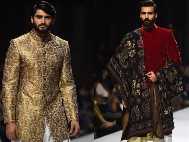 Two male models sport designer Obaid Shiekh’s creation on the ramp during the Karachi show. (AFP )