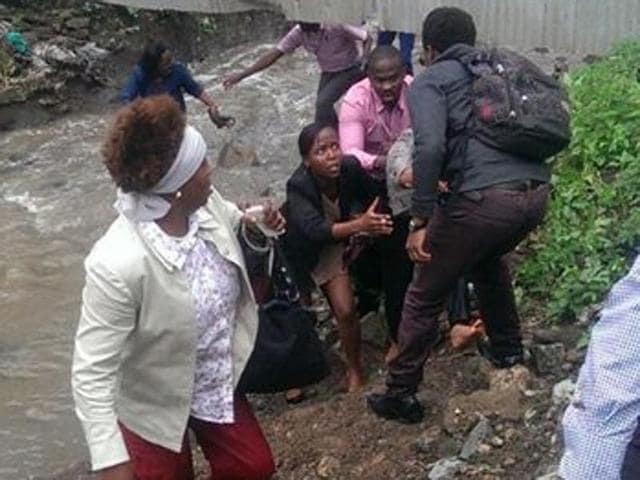 People run to escape the Strathmore University campus after hearing gunshots.(@Mate_Tongola/Twitter) People run to escape the Strathmore University campus after hearing gunshots.(@Mate_Tongola/Twitter)