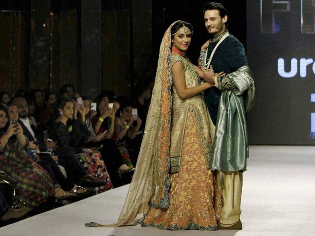 Models wearing a collection by Pakistani designer Wardha Saleem in Karachi on November 30. More than 20 designers showcased their creations in the 3-day Fashion Pakistan Week Winter Festive 2015. (AP)