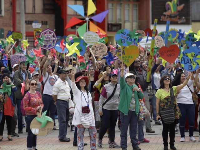 Protesters take part in a silent march calling for ambitious action to tackle climate change, in Bogota, Colombia, Sunday. (AP Photo) Protesters take part in a silent march calling for ambitious action to tackle climate change, in Bogota, Colombia, Sunday. (AP Photo)