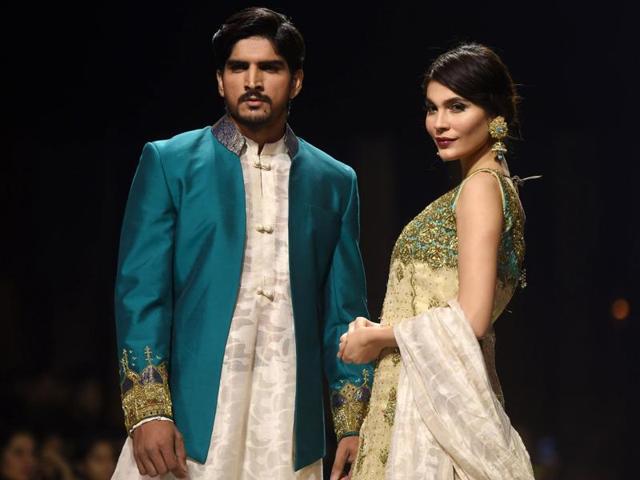 Models present creations by designer Obaid Shiekh during the Karachi show. (AFP)