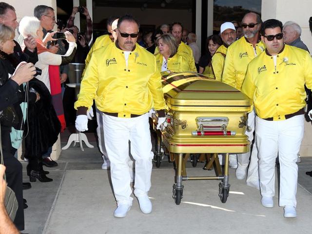 Pallbearers Richie Valles (L), Joji Barris (C) daughter, and son Jared Barris (R) during George Barris Celebration of Life Memorial and Burial Service at Forrest Lawn Memorial on Saturday. Barris is the man responsible for designing the iconic and much-loved ‘66 Batmobile. (AFP)
