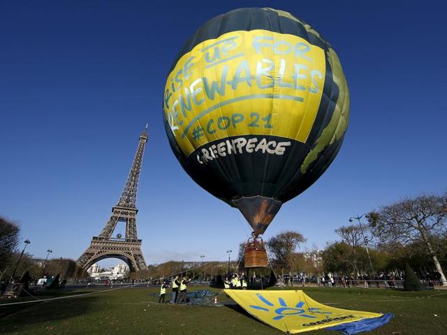 Greenpeace activists fly a hot air balloon depicting the globe next to the Eiffel Tower, in Paris. (Reuters Photo) Greenpeace activists fly a hot air balloon depicting the globe next to the Eiffel Tower, in Paris. (Reuters Photo)