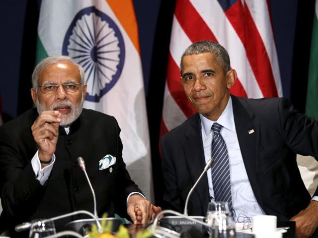US President Barack Obama and Prime Minister Narendra Modi clasp hands while meeting at the climate change summit in Paris.(Reuters Photo) US President Barack Obama and Prime Minister Narendra Modi clasp hands while meeting at the climate change summit in Paris.(Reuters Photo)