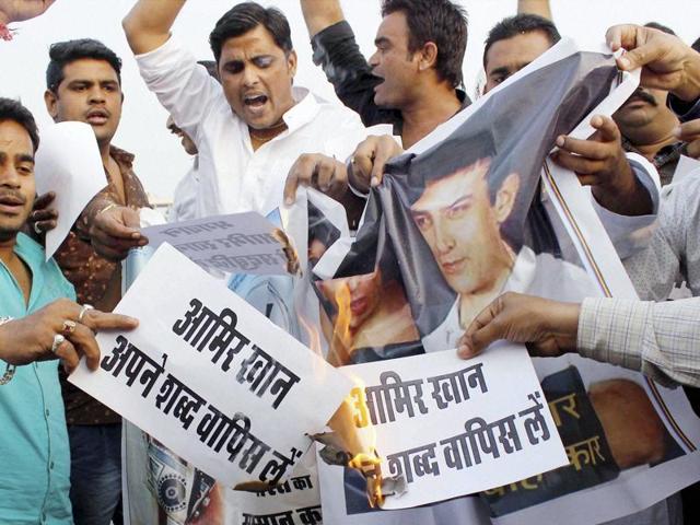 Youth display posters during a protest against actor Aamir Khan following his remarks over growing intolerance in the country in Jaipur. (PTI) Youth display posters during a protest against actor Aamir Khan following his remarks over growing intolerance in the country in Jaipur. (PTI)