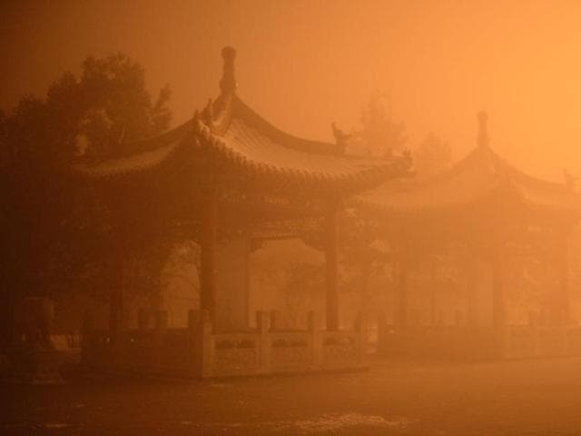 This picture taken on November 29, 2015 shows pagodas on a polluted day in Hohhot, north China's Inner Mongolia region. (AFP) This picture taken on November 29, 2015 shows pagodas on a polluted day in Hohhot, north China's Inner Mongolia region. (AFP)