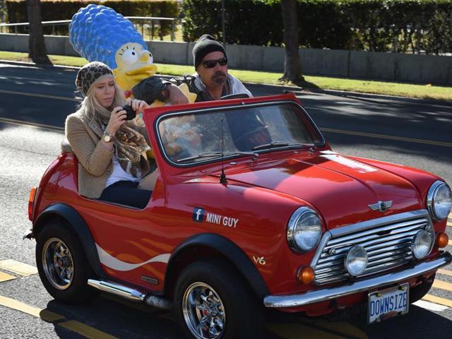 Mourners in a custom car arrive for the funeral service of legendary Hollywood film and television car builder George Barris at the Forest Lawn Cemetery. (AFP)