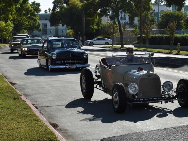 Mourners in hot rods and custom cars arrive for the funeral service of legendary Hollywood film and television car builder George Barris. He has also created vehicles for the TV shows Knight Rider, The Munsters and The Beverly Hillbillies and the films North by Northwest and Teenage Confidential. (AFP)