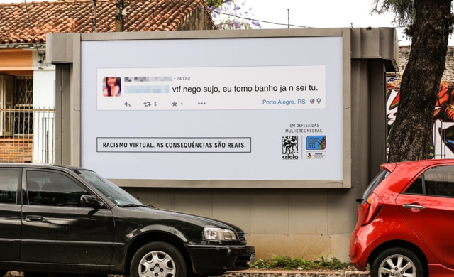 A billboard in Brazil displays an online racist comment which reads “GFY dirty ni*** I dunno u but I wash myself” by a local whose photo and name have been blurred out to conceal identity. (Official website)