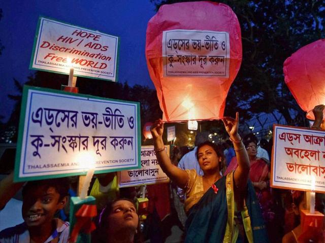 Children taking part in candle light rally on the eve of World AIDS Day in Kolkata. (PTI) Children taking part in candle light rally on the eve of World AIDS Day in Kolkata. (PTI)