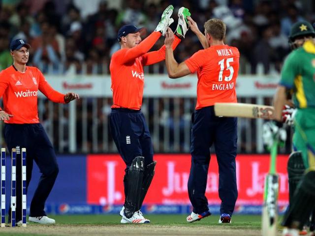 England's players celebrate dismissal of Pakistan's Ahmed Shahzad during third T20 cricket match between Pakistan and England at the Sharjah Cricket Stadium in Sharjah, United Arab Emirates, on November 30, 2015. (AP Photo) England's players celebrate dismissal of Pakistan's Ahmed Shahzad during third T20 cricket match between Pakistan and England at the Sharjah Cricket Stadium in Sharjah, United Arab Emirates, on November 30, 2015. (AP Photo)