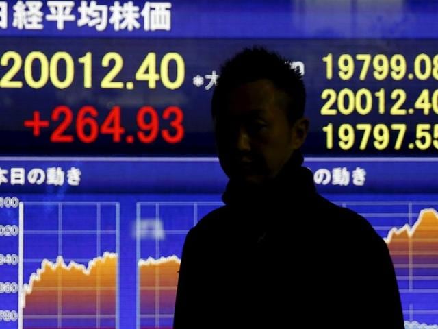 A man stands in front of an electronic board showing Japan's Nikkei average outside a brokerage in Tokyo. Japan’s public pension fund lost a whopping $64 billion in the July-September quarter as global equity markets plunged this summer on fears over China’s economy. (REUTERS) A man stands in front of an electronic board showing Japan's Nikkei average outside a brokerage in Tokyo. Japan’s public pension fund lost a whopping $64 billion in the July-September quarter as global equity markets plunged this summer on fears over China’s economy. (REUTERS)