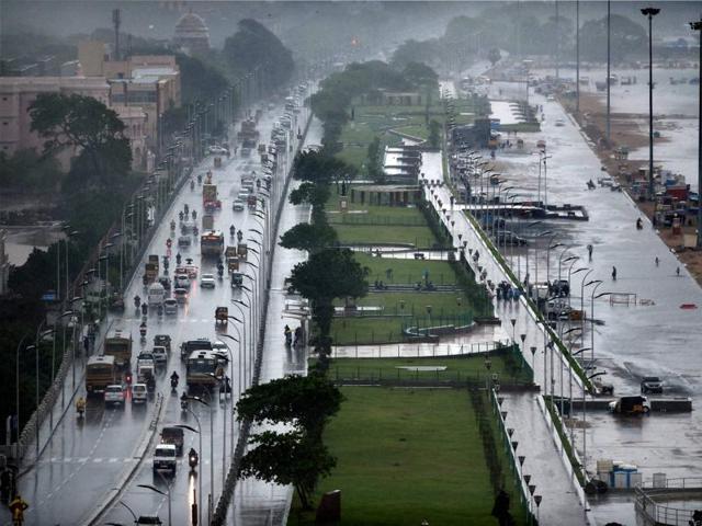 The Marina beach on the Bay of Bengal coast is partly covered with rainwater after heavy rains in Chennai on Tuesday. Normal life has been badly affected due to incessant rains. (PTI)