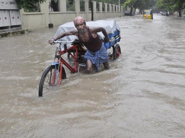 Normal life was thrown out of gear as heavy rains battered Chennai and north Tamil Nadu, with the Met office predicting more of the same in the region over the next three days. (HT Photo)