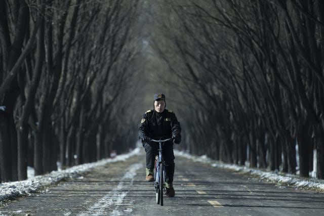 A man rides his bike on a road in Guanting, outside of Beijing. (AFP Photo) A man rides his bike on a road in Guanting, outside of Beijing. (AFP Photo)