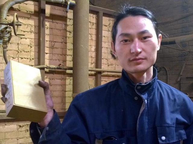 Chinese artist Wang Renzheng holds up a brick in Tangshan in northern China's Hebei province containing dust and pollutants Wang vacuumed from the air in Beijing. (AP Photo) Chinese artist Wang Renzheng holds up a brick in Tangshan in northern China's Hebei province containing dust and pollutants Wang vacuumed from the air in Beijing. (AP Photo)