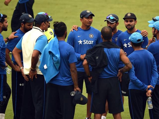 India's captain Virat Kohli talks with teammates and support staff during a training session ahead of the fourth Test cricket match between India and South Africa at The Feroz Shah Kotla Stadium on December 1, 2015.(AFP Photo)