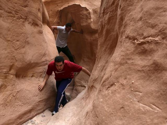 Hikers walk among the walls of the Closed Canyon in South Sinai, Egypt, November 21, 2015.  (REUTERS) 
