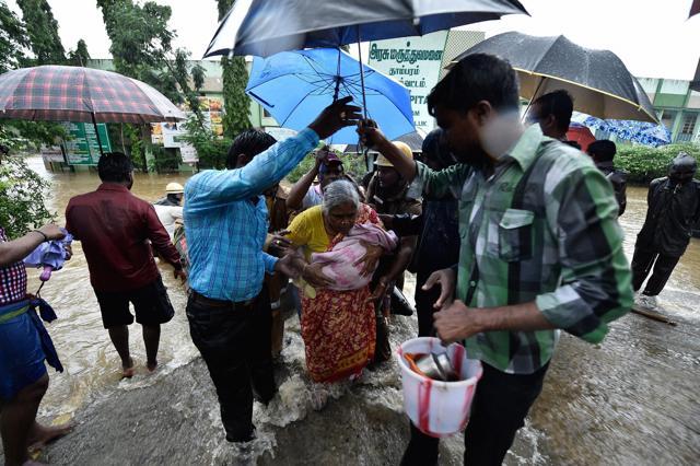 Patients are being shifted to safe place from a flooded hospital after heavy rains in Chennai. (PTI) Patients are being shifted to safe place from a flooded hospital after heavy rains in Chennai. (PTI)