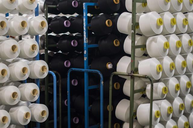 Spools of yarn made using plastic waste at a yarn processing plant in Angles, north-eastern Spain. (AFP) Spools of yarn made using plastic waste at a yarn processing plant in Angles, north-eastern Spain. (AFP)